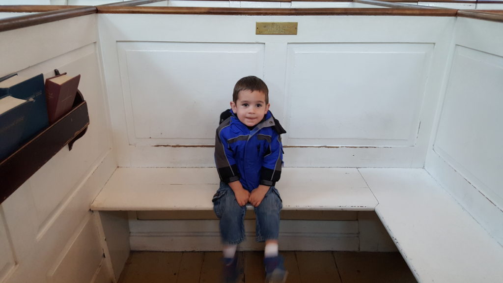 young boy in pew at Old North Church