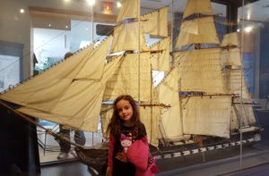 child with model ship
