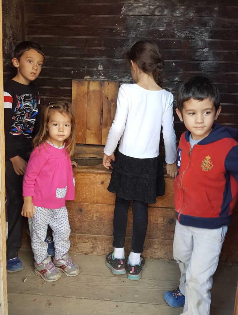 children in outhouse