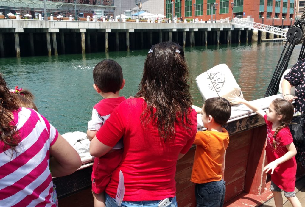 children throw tea into the harbor