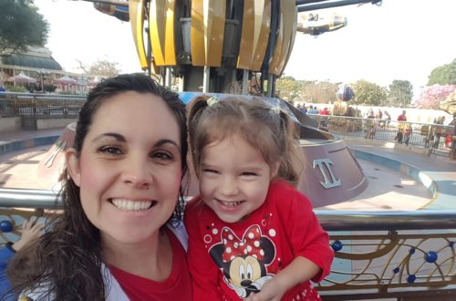 Mom and child in front of the Rocket ride at Disneyland